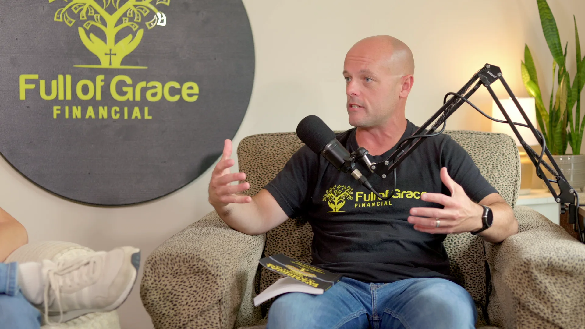 Podcast host gesturing as he talks during a Full of Grace Financial recording